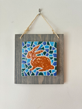 Hanging tiles, mosaics mounted on weathered board (various designs)