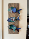 Hanging tiles, mosaics mounted on weathered board (various designs)